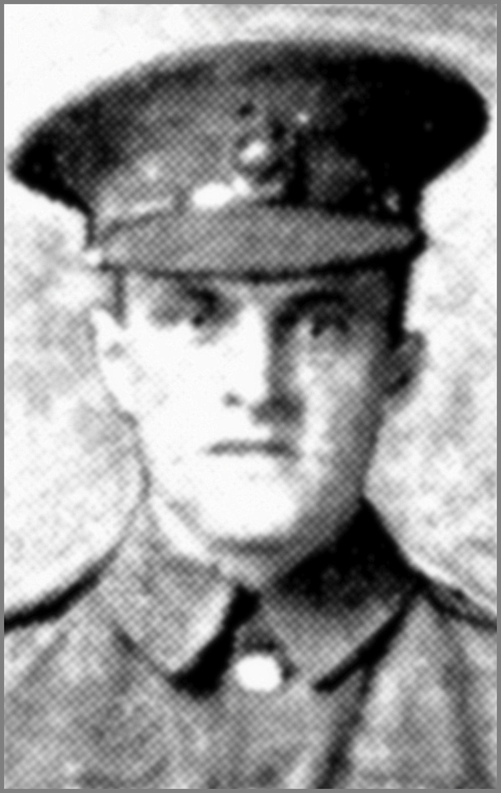 A poor quality newspaper photograph of a British Army soldier in uniform and cap.