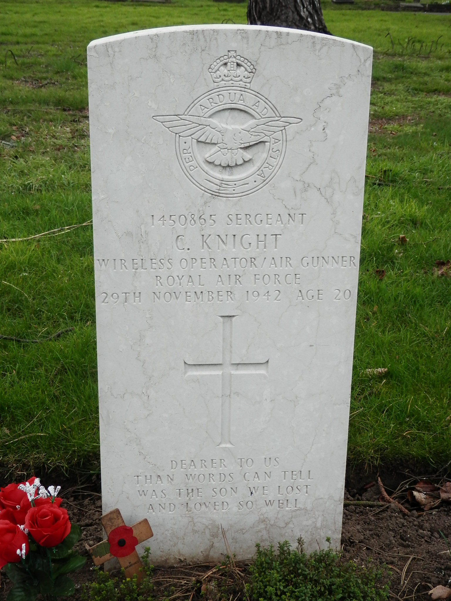 A white Commonwealth War Graves Commission gravestone with details for Corporal Allan Whitaker.