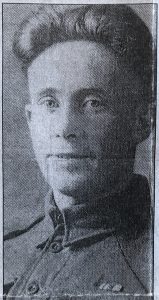 A newspaper photograph of a man in Army uniform.