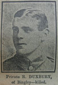 A newspaper quality image of a man's head and shoulders with him looking to the left of the picture. He is clean shaven with short dark hair and is to be wearing an Army jacket.
