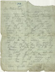 A hand written letter home on a slighty torn piece of paper.