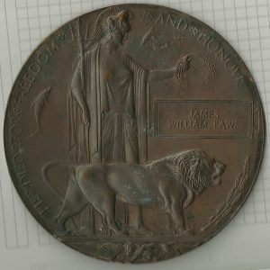 A bronze war memorial plaque. these are the size of a DVD and have an image of Brittania holding a laurel wreath and a lion roaring.