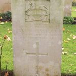 A Commonwealth War Graves Commission headstone. This is made of white stone and inscribed with the details of Private Richard Hartley, killed when Charles Green was wounded.