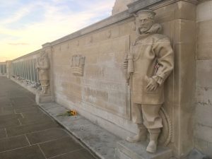 A sandstone carving of a large panel and two carved sailor statues at the Portsmouth War Memorial.