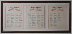 A framed and glazed board with three separate pieces of paper with hand written names.