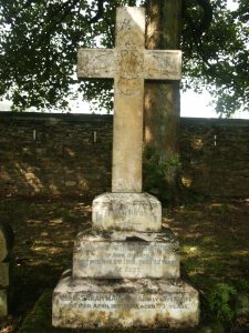 A white granite cross with a stepped base. On the base is an inscription to Arthur Rushworth who died in the Great War whilst in service with the Royal Air Force.