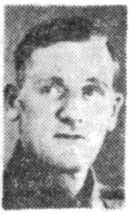 A poor quality newspaper photograph from 1944, of a soldier's head and shoulders. He is facing the camera.
