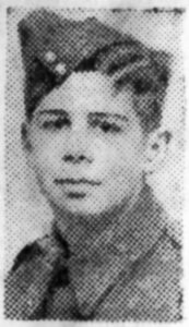 A poor quality newspaper photograph from 1944, of a soldier's head and shoulders. He is wearing a forage cap and is facing the camera.