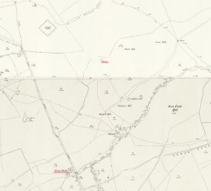 A section of an ordnance survey map showing fields and a small water reservoir.