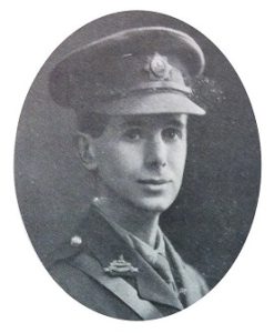 A head and shoulders portrait of a British Army officer in uniform with a field service cap and the officer's badge of the Lincolnshire Regiment.