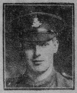 A poor quality newspaper photograph from 1916, of a soldier's head and shoulders. He is wearing a peaked cap with a West Riding Regiment badge and is facing the camera.