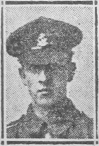 A newspaper image of a man's head and shoulders. He is wearing Army uniform and a peaked cap with a badge.