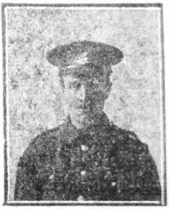 A newspaper image of a man's head and shoulders. He is wearing Army uniform and a peaked cap with a badge.