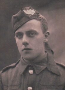 A studio photograph of a British Army soldier in the uniform of the Cameronians (Scottish) Regiment. He is wearing a glengarry cap with the Cameronians badge and is facing the camera.